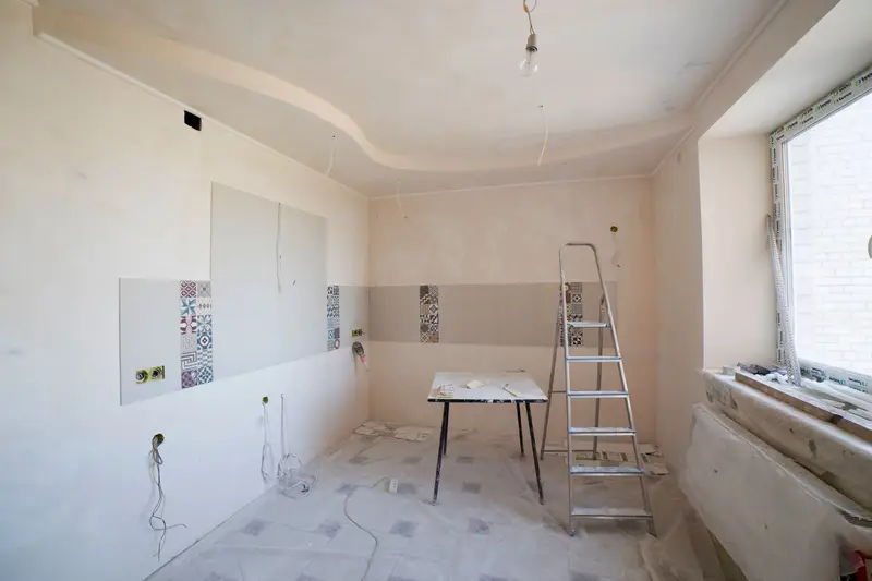 Room being prepared for renovation with a stepladder and table